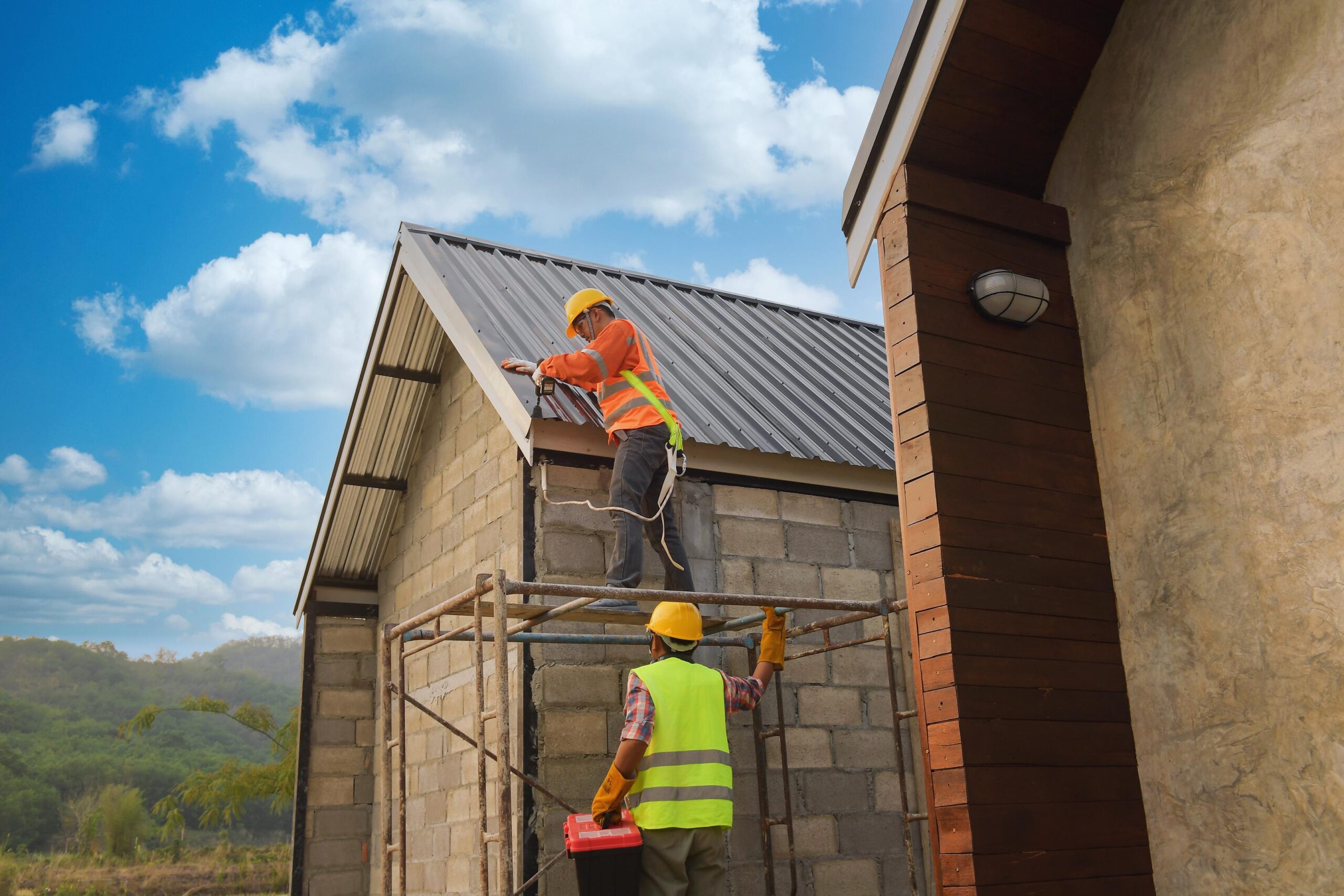 Roofers on Scaffolding Building a New House