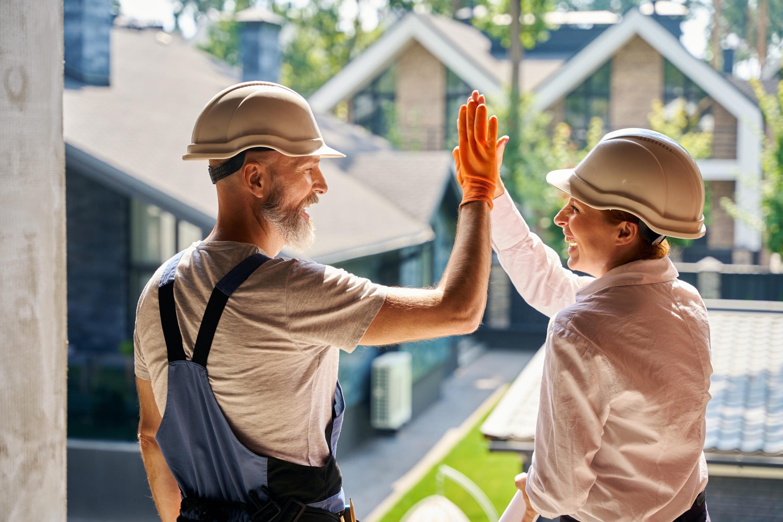 Roofer Team High-Five Success Building New Homes