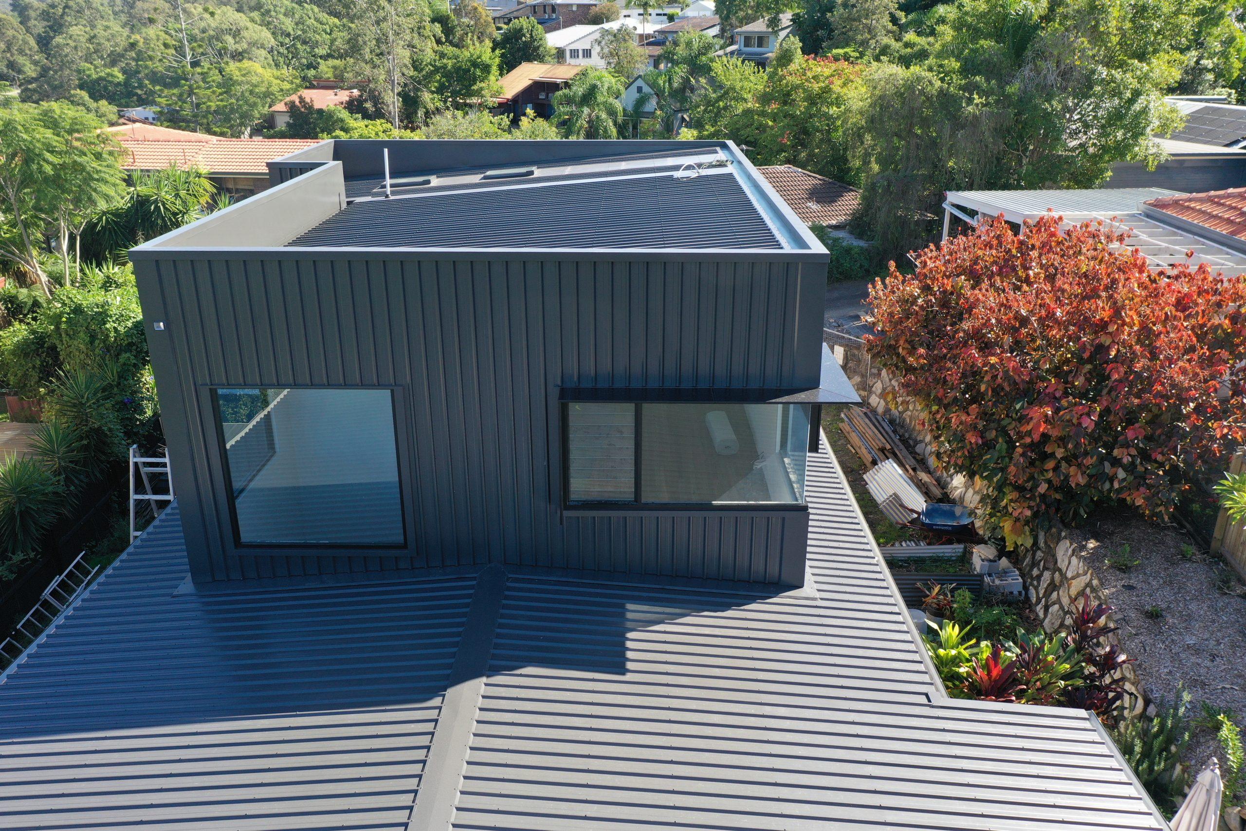 Roofer Repairing Tile Roof On House During Daytime