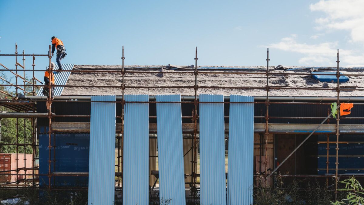 infinite roofing team working on commercial project